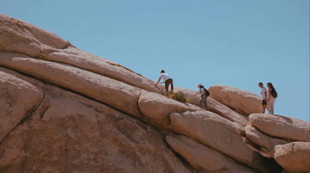 Climbing on rocks at Joshua Tree National Park