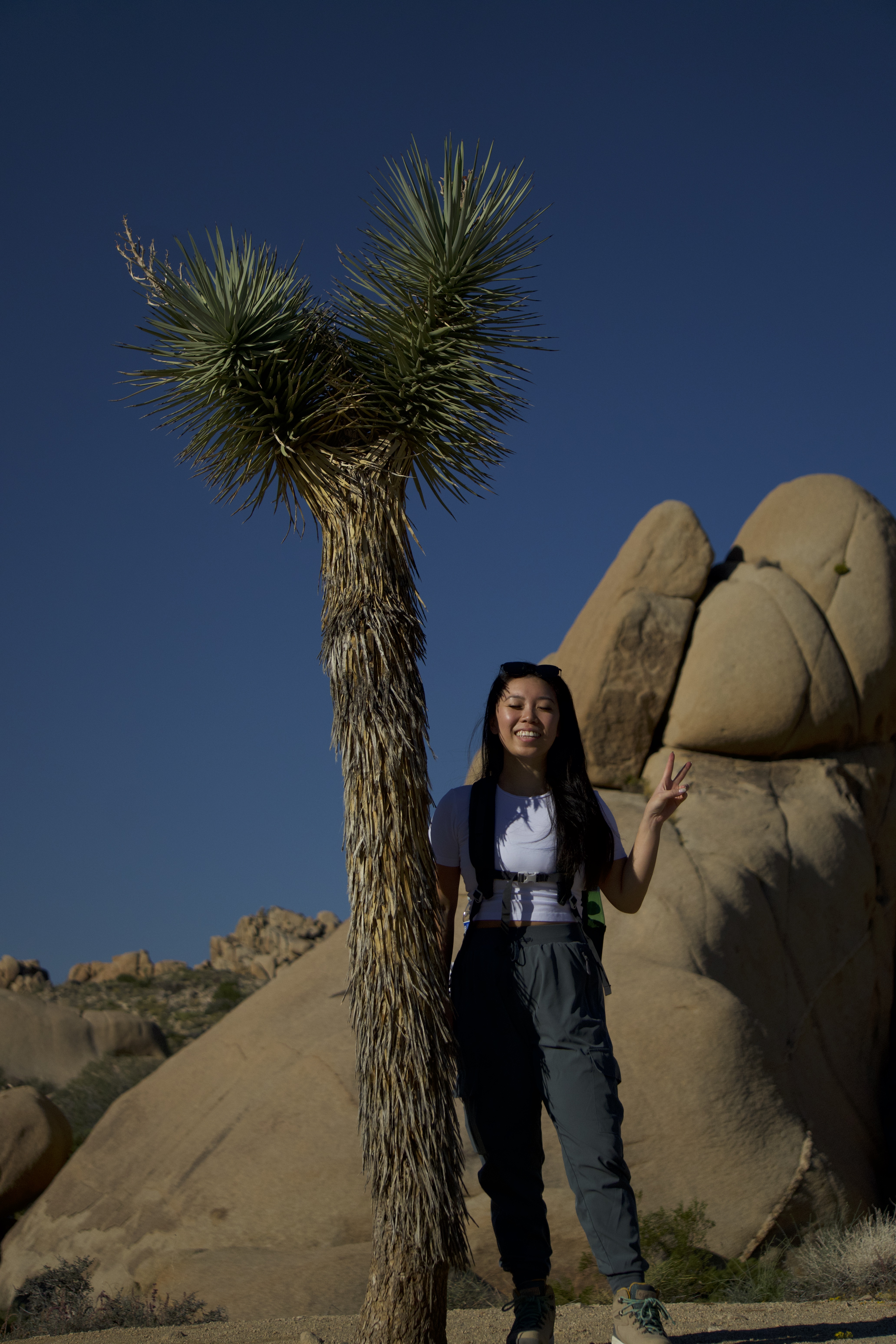 Posing beside a Joshua Tree at Joshua Tree National Park