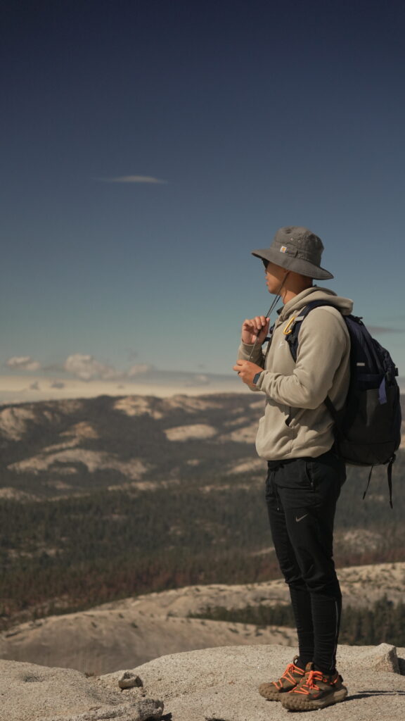 Admiring the view of Yosemite Valley atop the Half Dome