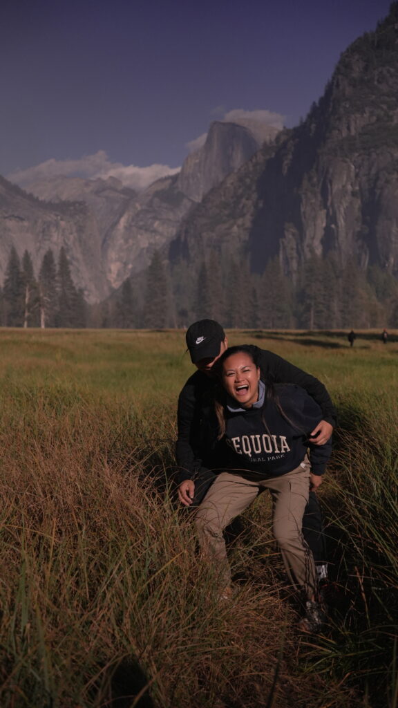 A couple laughing at Leidig Meadows in Yosemite National Park